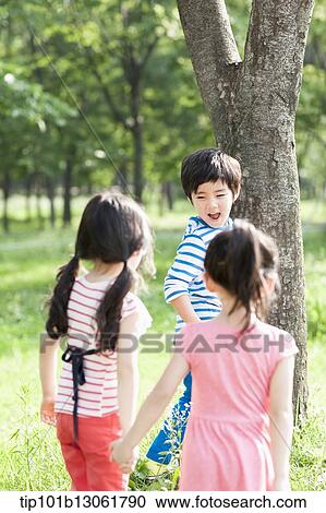 Stock Image - kids playing in the nature. Fotosearch
