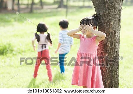 Stock Image - kids playing in the nature. Fotosearch
