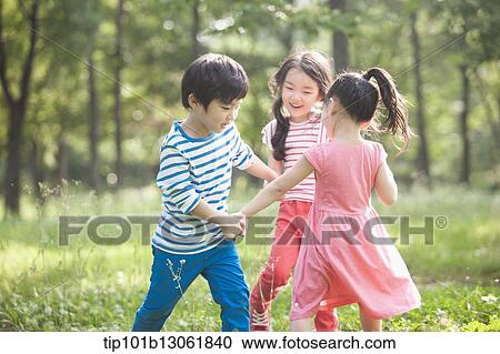 Stock Image - kids playing in the nature. Fotosearch
