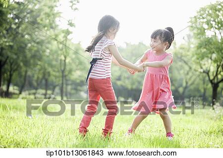 Stock Image - kids playing in the nature. Fotosearch
