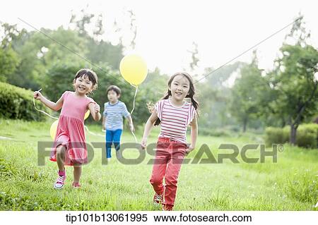 kids playing with balloons View Large Photo Image Stock Photography - kids playing with balloons. Fotosearch