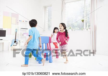 kids playing with different color chairs View Large Photo Image Stock Image - kids playing with different color chairs. Fotosearch