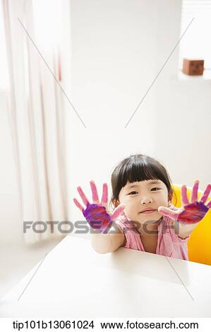 Picture - kids playing with finger colors. Fotosearch