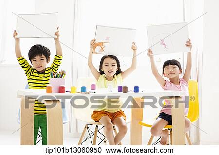 Stock Image - kids playing with finger colors. Fotosearch