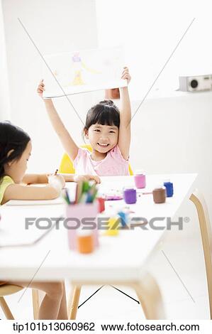 Stock Image - kids playing with finger colors. Fotosearch
