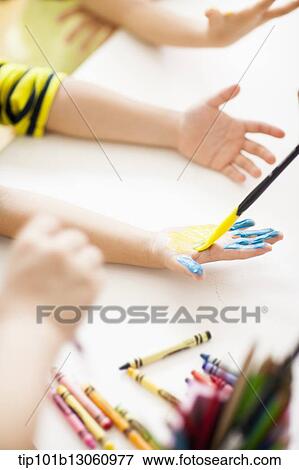 Stock Photo - kids playing with finger colors. Fotosearch