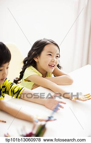 Stock Photo - kids playing with finger colors. Fotosearch