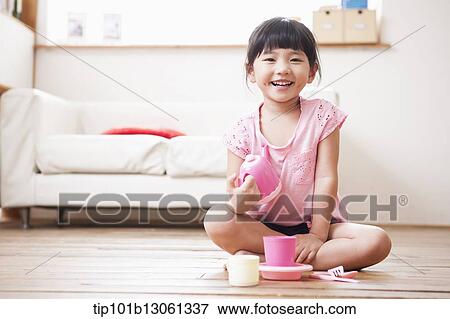 Stock Photo - kids playing with toy dishes. Fotosearch