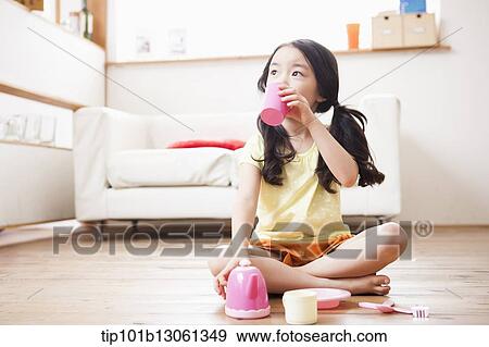 Stock Photo - kids playing with toy dishes. Fotosearch