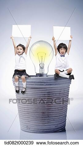 kids sitting on a vase with light bulb View Large Photo Image Stock Photo - kids sitting on a vase with light bulb . Fotosearch
