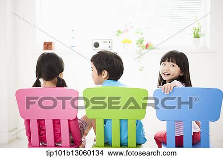 kids sitting on chairs View Large Photo Image Picture - kids sitting on chairs. Fotosearch