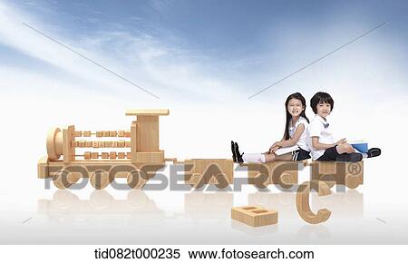 kids sitting on wooden train View Large Photo Image Stock Photography - kids sitting on wooden train. Fotosearch
