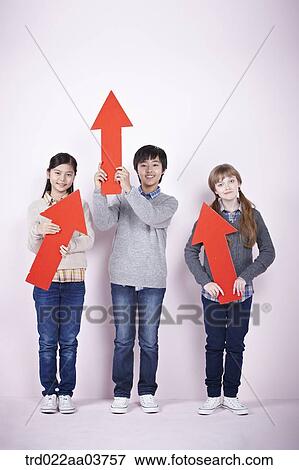 kids standing and holding red arrows View Large Photo Image Stock Photo - kids standing and holding red arrows. Fotosearch