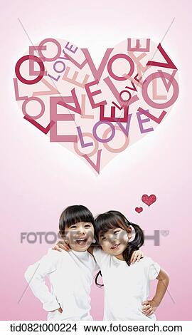 kids with a heart shape above saying love View Large Photo Image Picture - kids with a heart shape above saying love. Fotosearch