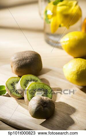 kiwi fruits and lemons on the wooden floor View Large Photo Image Stock Image - kiwi fruits and lemons on the wooden floor. Fotosearch