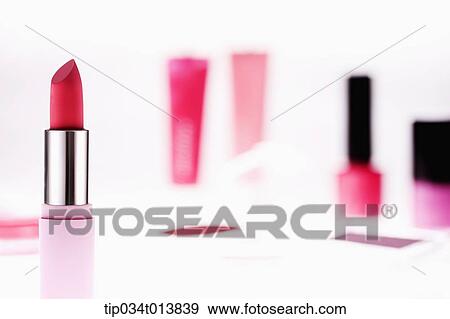 lipsticks and nail polish in white background View Large Photo Image Stock Photo - lipsticks and nail polish in white background. Fotosearch