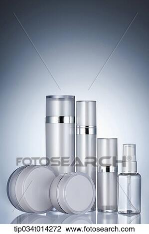 Stock Image - make up set in grey background. Fotosearch
