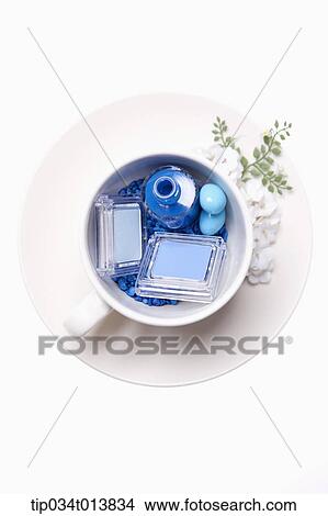 Picture - make ups in a white cup. Fotosearch