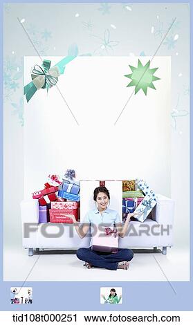memo template featuring a woman sitting in front of a couch full of gifts View Large Photo Image Stock Image - memo template featuring a woman sitting in front of a couch full of gifts . Fotosearch