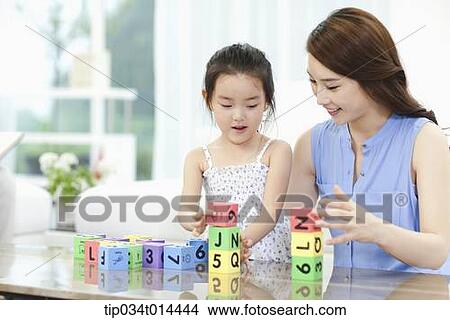 mother and daughter playing with toy blocks View Large Photo Image Picture - mother and daughter playing with toy blocks . Fotosearch