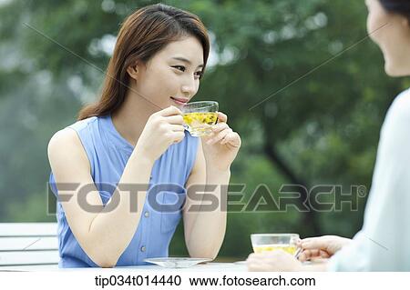 mother and grown up daughter having cup of tea View Large Photo Image Stock Image - mother and grown up daughter having cup of tea. Fotosearch