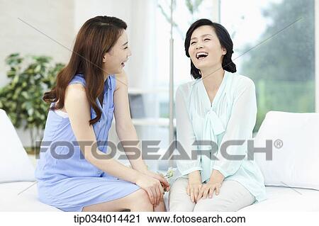 mother and grown up daughter smiling together View Large Photo Image Stock Image - mother and grown up daughter smiling together. Fotosearch