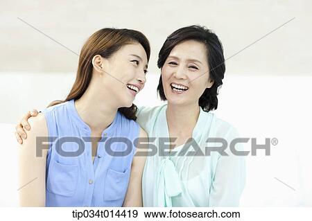 mother and grown up daughter smiling together View Large Photo Image Stock Photo - mother and grown up daughter smiling together. Fotosearch