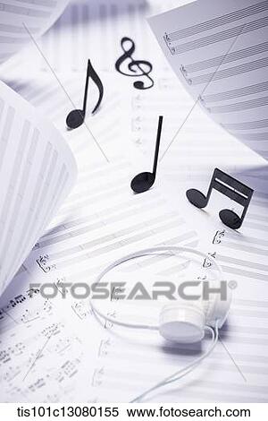 musical notes and headset on musical papers View Large Photo Image Stock Photography - musical notes and headset on musical papers . Fotosearch