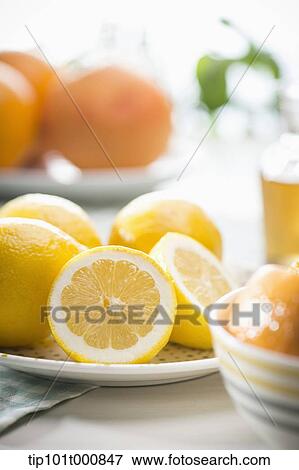 Stock Photo - oranges on a white plate. Fotosearch