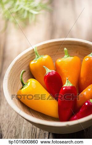 Stock Image - paprika in wooden bowl. Fotosearch