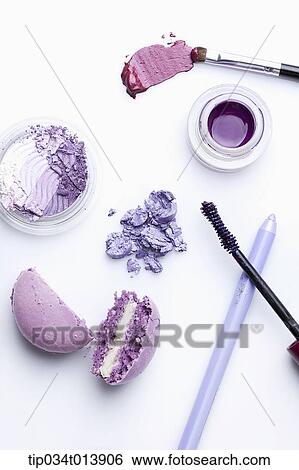 Stock Photograph - purple make ups in white background. Fotosearch