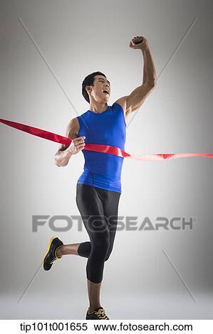 side shot of a fit man in blue shirt running to a finishing line View Large Photo Image Stock Photography - side shot of a fit man in blue shirt running to a finishing line. Fotosearch