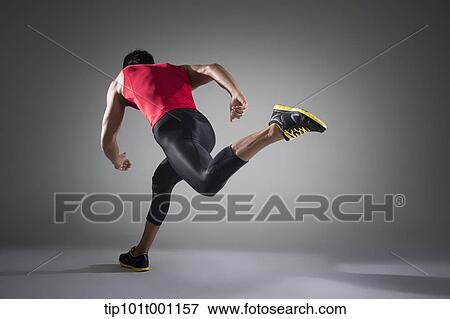 Stock Photo - side shot of a runner in starting position. Fotosearch