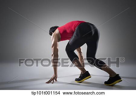 side shot of a runner in starting the run View Large Photo Image Picture - side shot of a runner in starting the run. Fotosearch