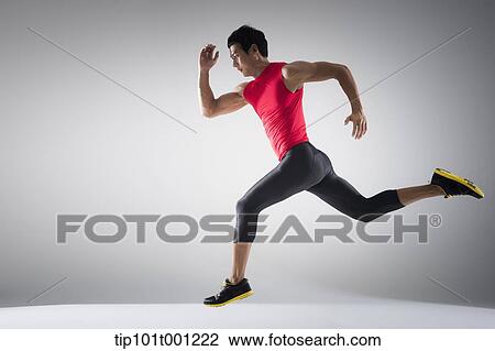 Stock Image - side shot of a runner running fast. Fotosearch