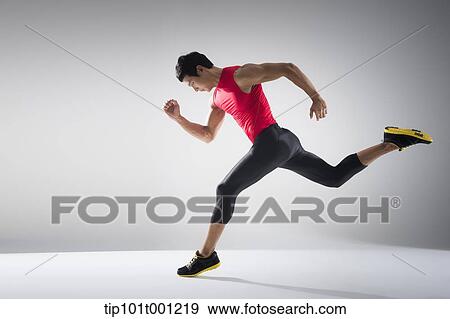 Stock Photo - side shot of a runner running fast. Fotosearch