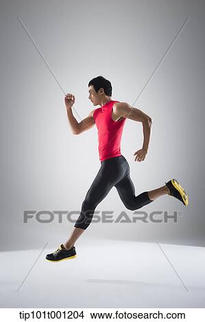 Picture - side shot of a runner running. Fotosearch