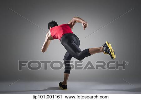 Stock Image - side shot of a runner running . Fotosearch