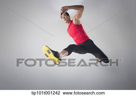 side shot of an athlete jumping View Large Photo Image Stock Image - side shot of an athlete jumping . Fotosearch