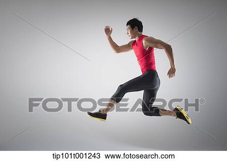 side shot of an athlete jumping View Large Photo Image Stock Image - side shot of an athlete jumping . Fotosearch