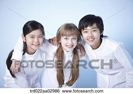 three kids hugging each other View Large Photo Image Stock Photograph - three kids hugging each other. Fotosearch