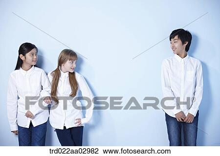 three kids looking at each other View Large Photo Image Stock Image - three kids looking at each other. Fotosearch