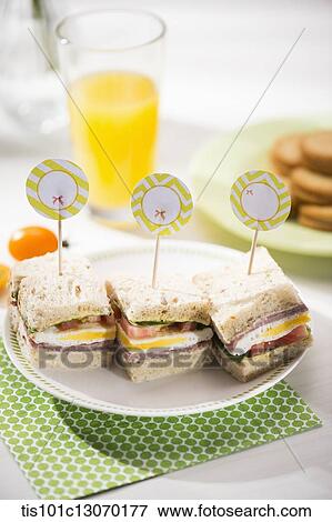 three sandwiches on a plate View Large Photo Image Stock Photo - three sandwiches on a plate. Fotosearch