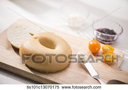 tiny tomatoes next to a bagel View Large Photo Image Stock Photography - tiny tomatoes next to a bagel. Fotosearch