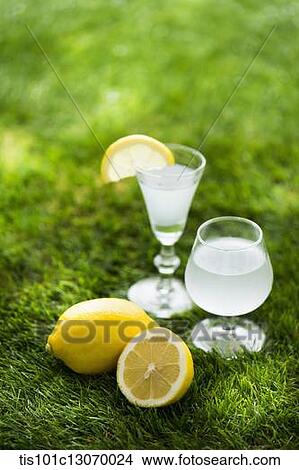 Picture - two drinks standing on the grass. Fotosearch