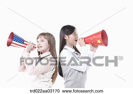 two girls dressed as students with paper megaphones View Large Photo Image Stock Image - two girls dressed as students with paper megaphones. Fotosearch