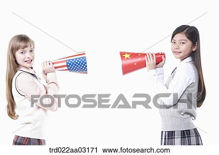 two girls dressed as students with paper megaphones View Large Photo Image Stock Image - two girls dressed as students with paper megaphones. Fotosearch