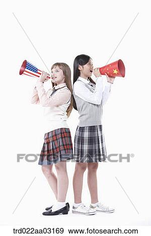 two girls dressed as students with paper megaphones View Large Photo Image Stock Photo - two girls dressed as students with paper megaphones. Fotosearch
