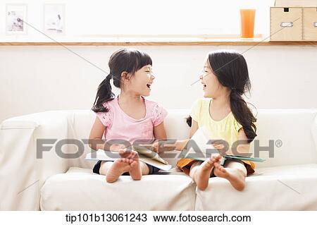 two girls reading a book View Large Photo Image Stock Image - two girls reading a book. Fotosearch