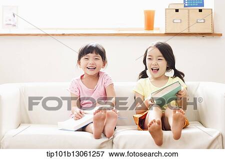 two girls reading a book View Large Photo Image Stock Photo - two girls reading a book. Fotosearch